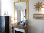 Bedroom: Marble fireplace with classic mirror, and large closet